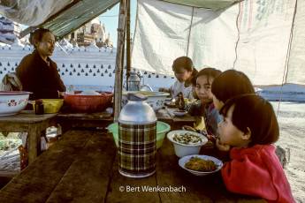 Little children having a delicious meal at one of the street stalls at Nyaung Shwe