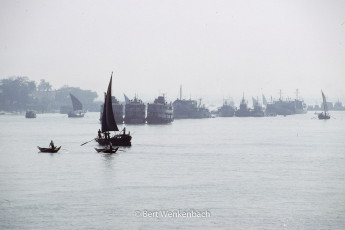 Sea going vessels, river ferries and traditional sailing boats in the estuary of the Yangon River